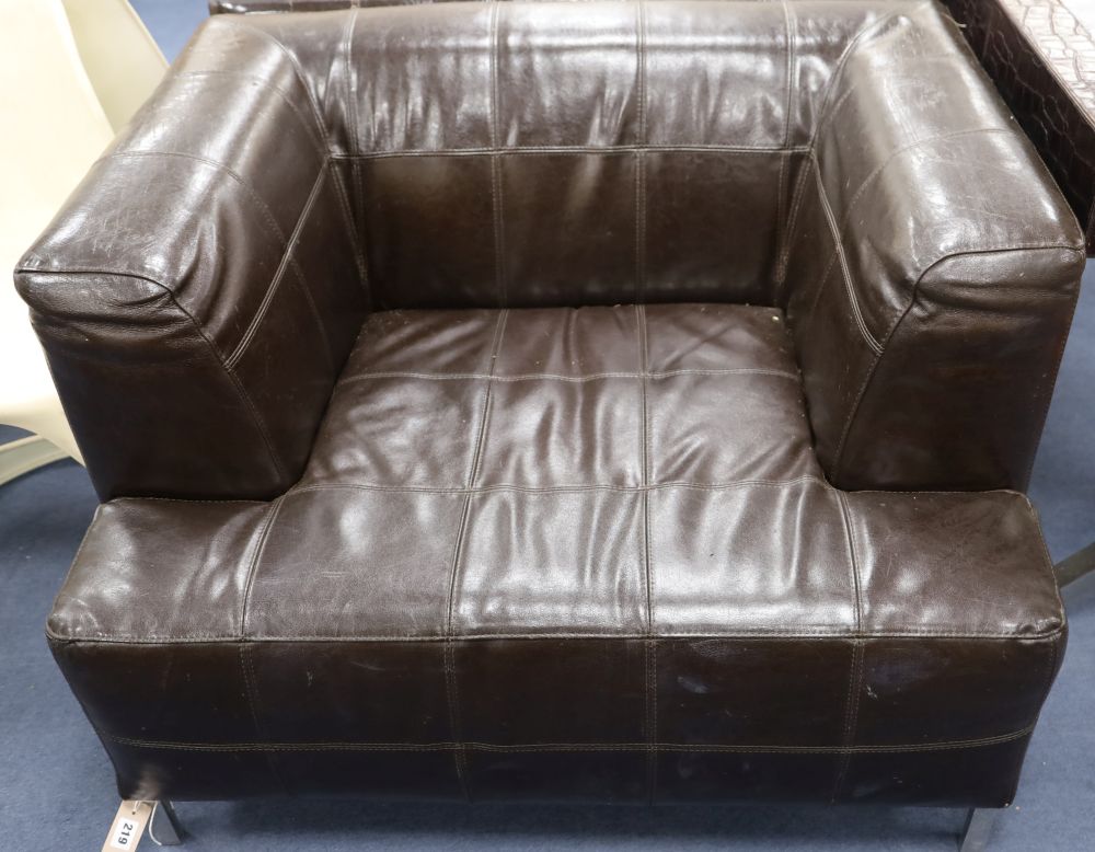 A pair of Andrew Martin brown leather armchairs, width 100cm depth 84cm height 70cm